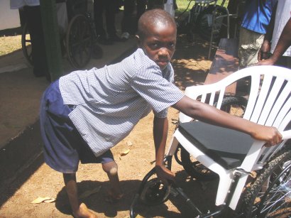 getting into his NEW wheelchair!